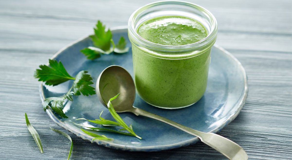 A jar of salad dressing on a plate